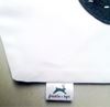 Close up view of Samples of 30mm x 50mm Polyester Satin Tags sewn onto item